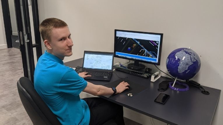Spatial analyst in front of a computer