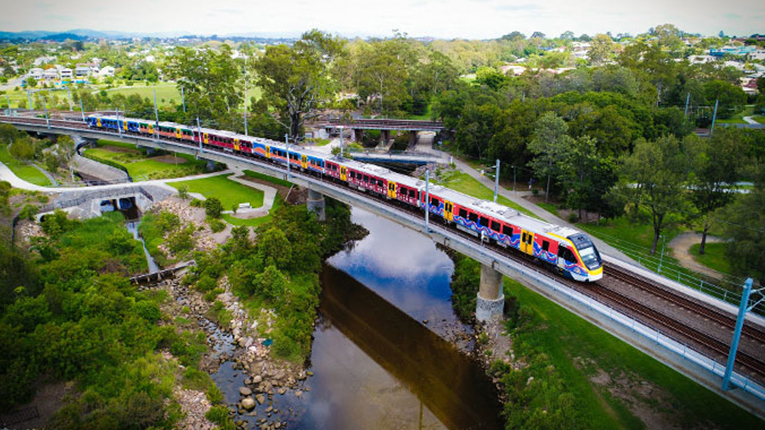 Brisbane Airtrain image with of training travelling on a bridge over water
