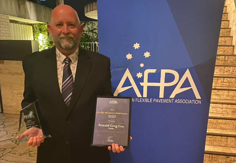 Greg Cox pictured in front of an AfPA banner