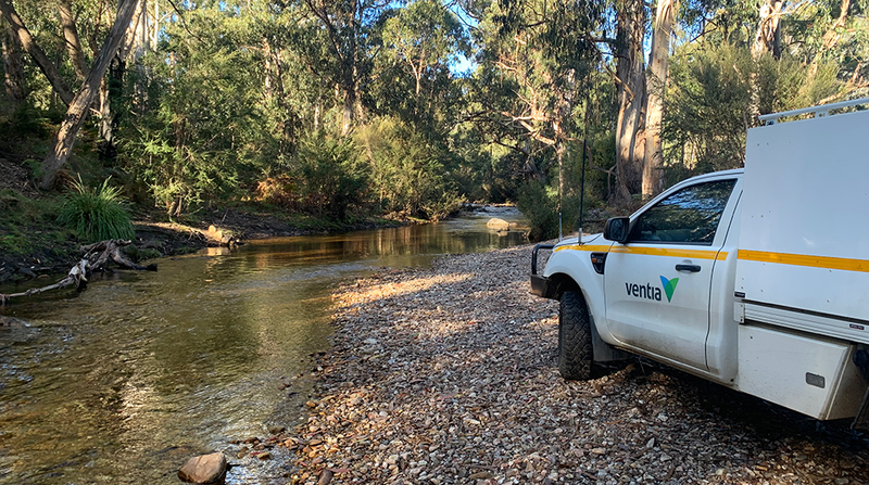 Ventia vehicle parked along a stream in a bushland