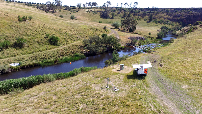 Drone shot of bushland with a water monitoring device
