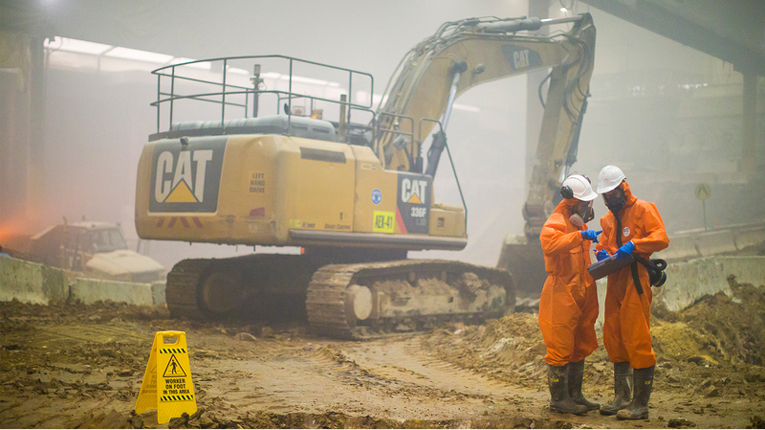 Barangaroo project site featuring machinery and two individuals in protective attire